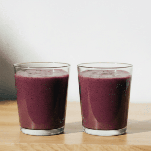 close up of two glasses of beet orange ginger juice