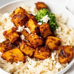 Dig into this scrumptious adobo roasted squash with jalapeno Cilantro Pesto with zero guilt.