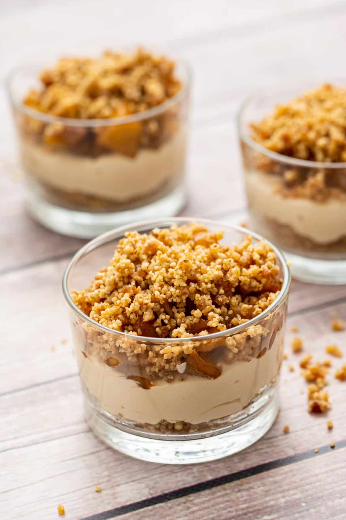 3 mini apple cheesecakes in glass cups