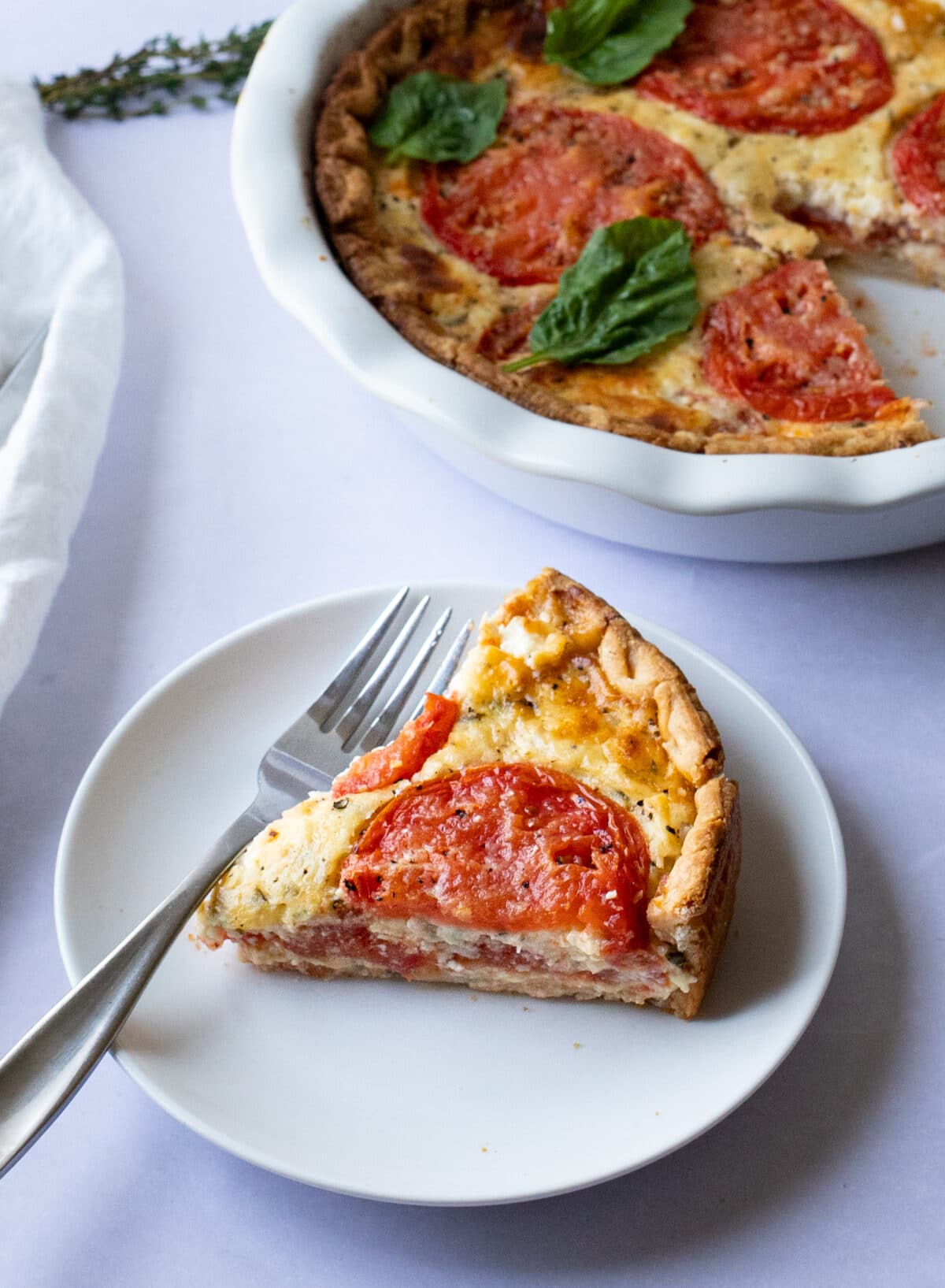 slice of pizza pie on a white serving plate