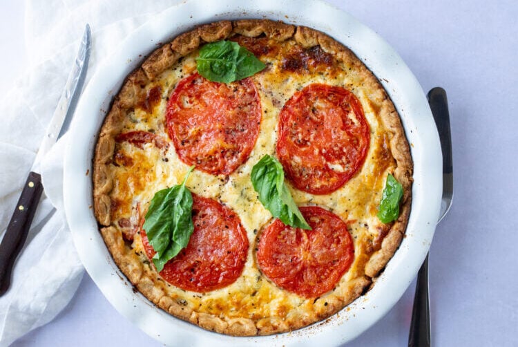 Our deep dish tomato pie is a wonderfully rich and flavorful southern dish!
