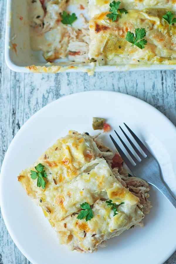 view of casserole dish and plate with a fork