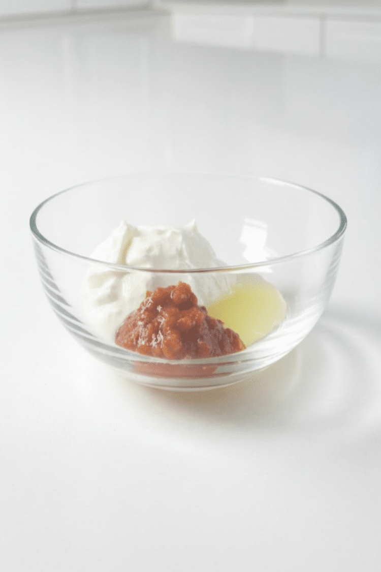 ingredients for creamy chipotle sauce in a bowl before being mixed