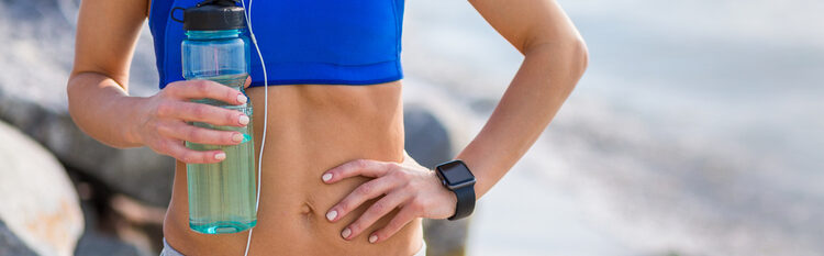 woman with water bottle jogging