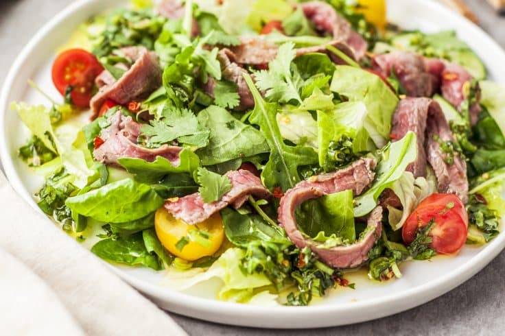 thai beef salad recipe on a white place with a close up view