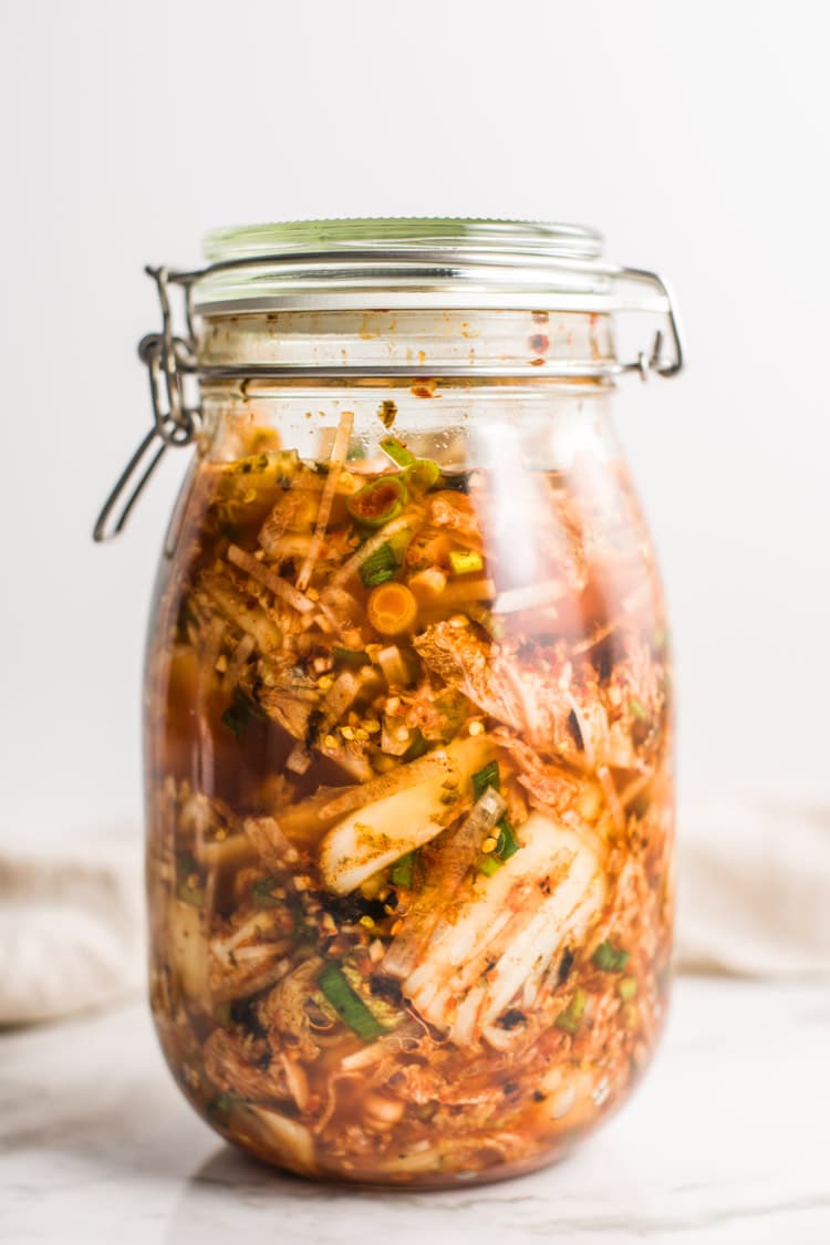 Kimchi fermenting in a mason jar.