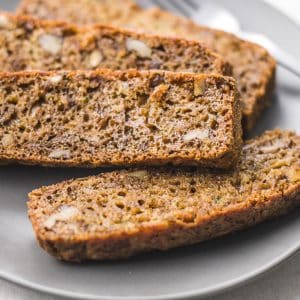 sliced zucchini bread on a gray plate