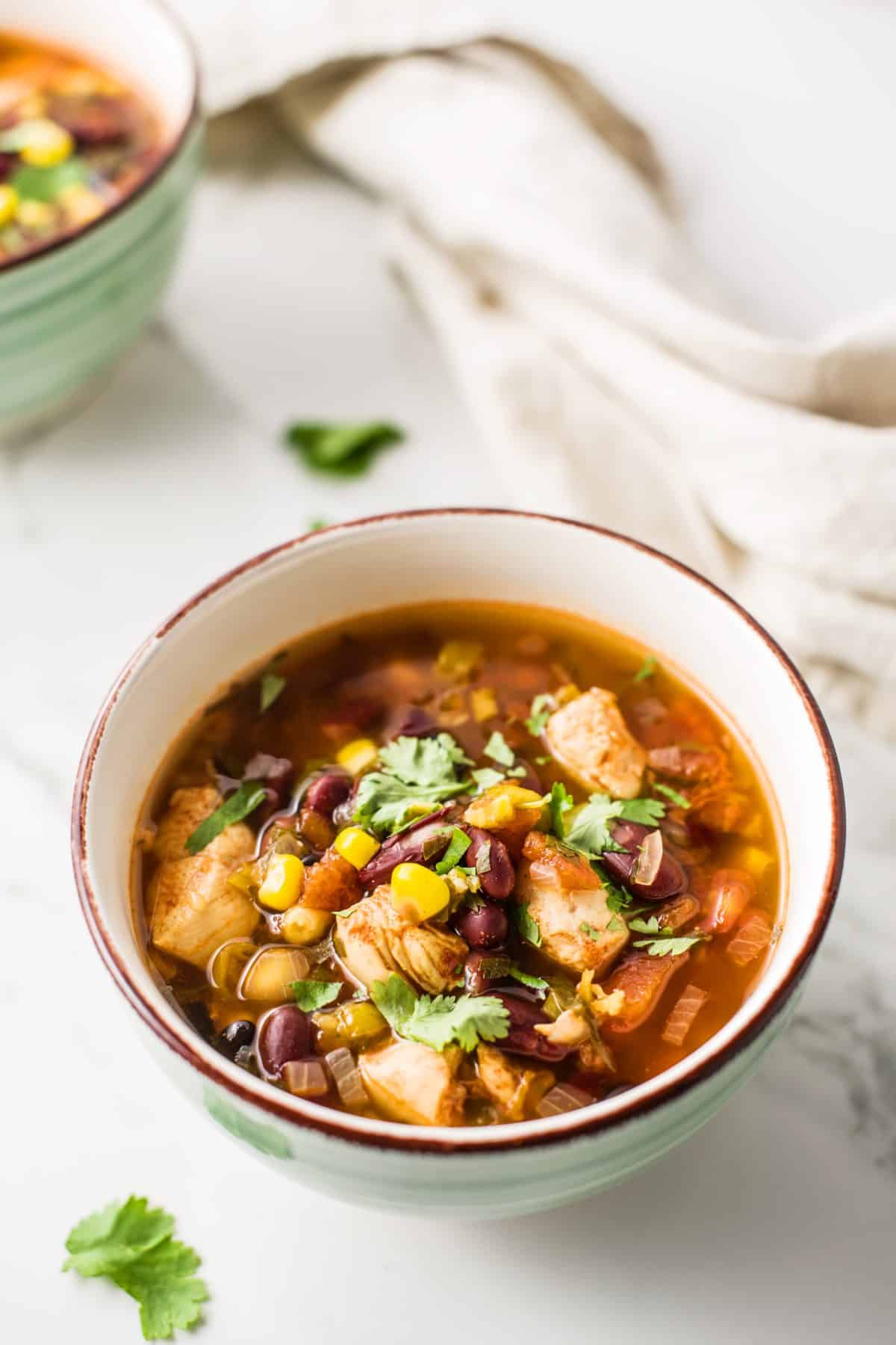 fiesta chicken soup in a white bowl