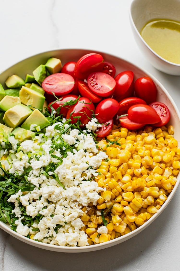 Elote Tomato Avocado Salad blends roasted corn, minus the cob, with the right amount of spices and textures