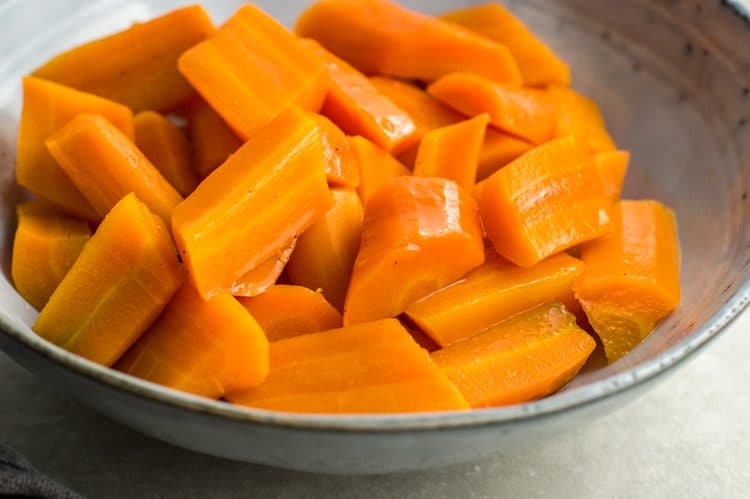 instant pot spiced orange carrots in a gray bowl