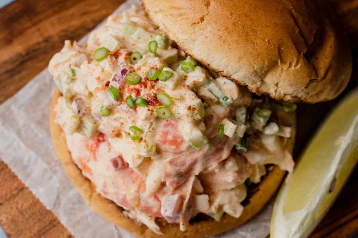 lobster roll with top off to see lobster mixture