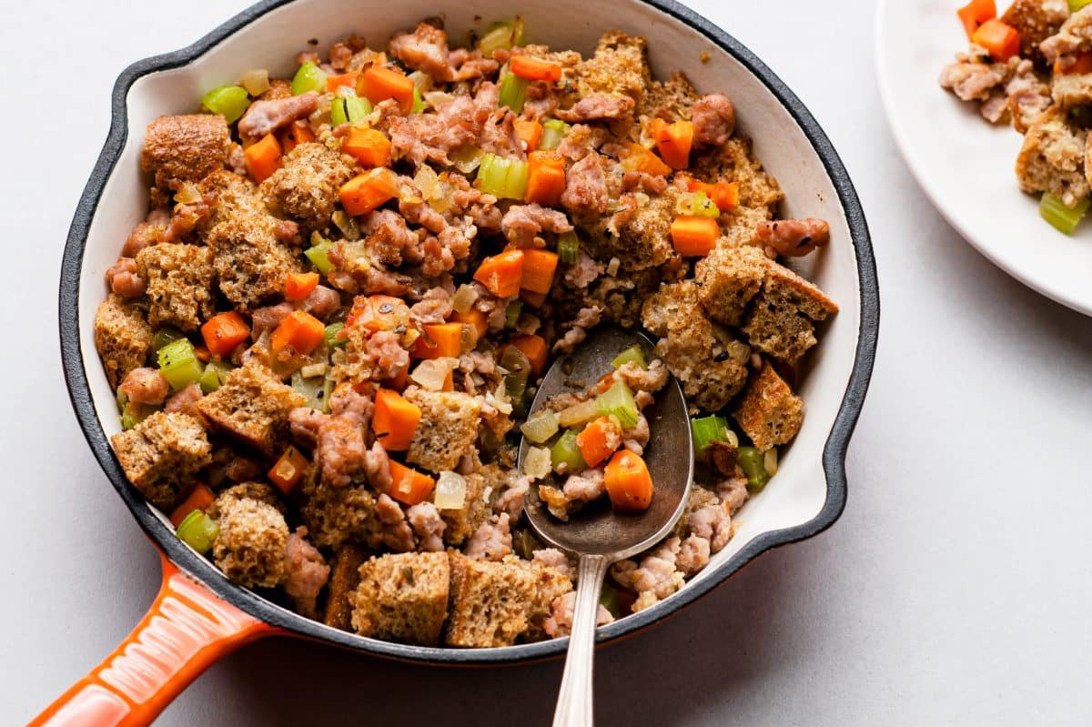 stuffing in a pan with a serving spoon