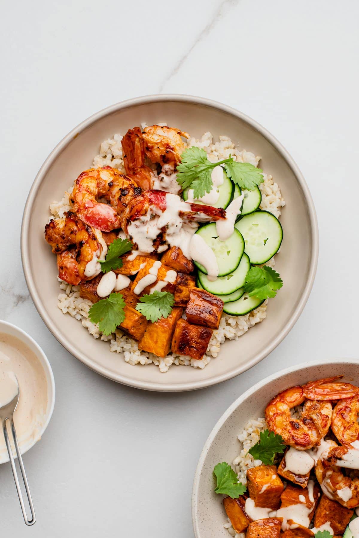 One main grain bowl with a partial view of another in the bottom right corner