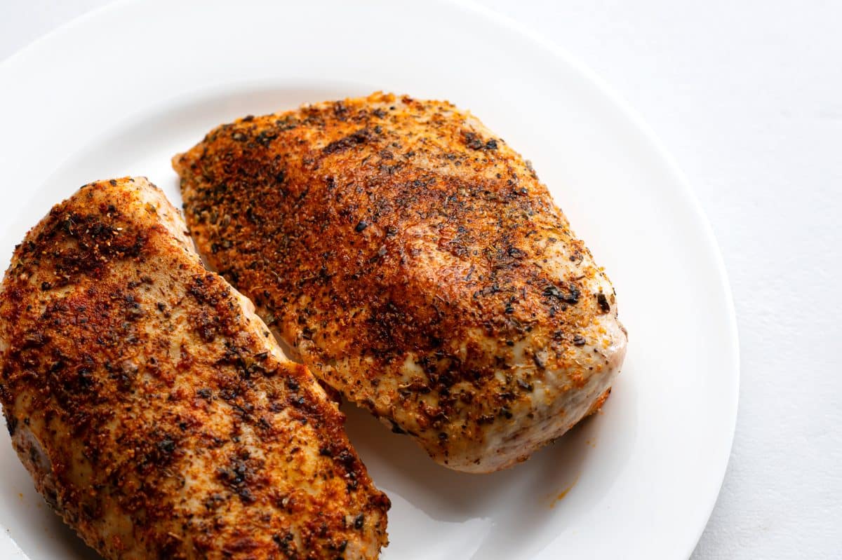 2 whole cooked and seasoned chicken breasts