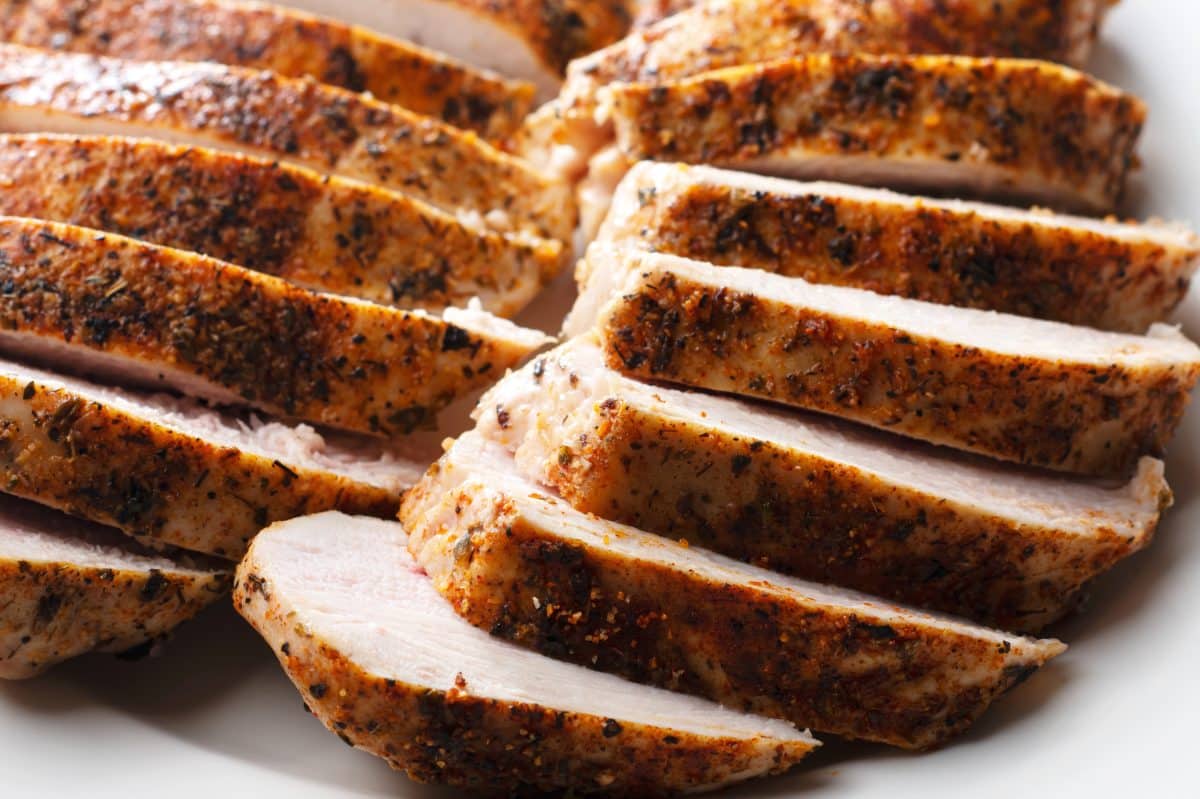 two sliced chicken breasts that are fully cooked