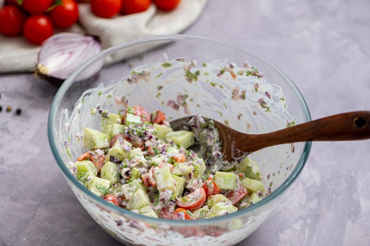 Cucumber salad in a glass bowl, one of the best low carb side dishes!