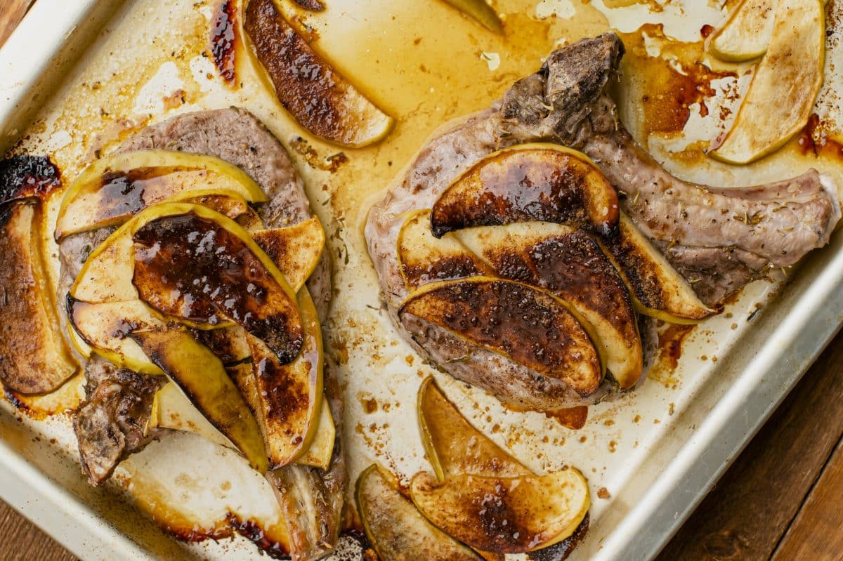 another view of baked apple pork chops on baking sheet
