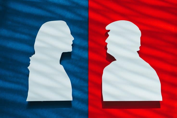 Silhouette of Kamala Harris and Donald Trump facing each other with party colors.
