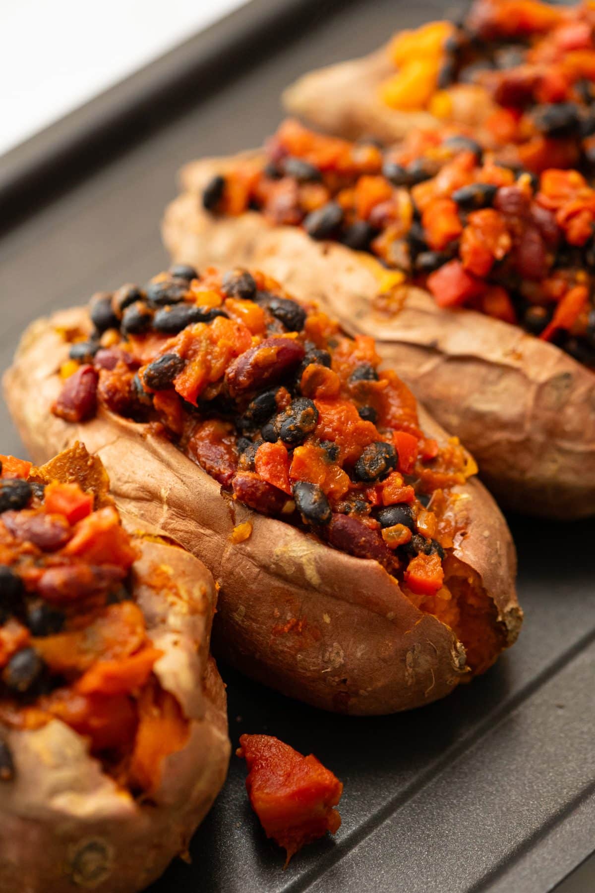 chili stuffed sweet potatoes on baking sheet