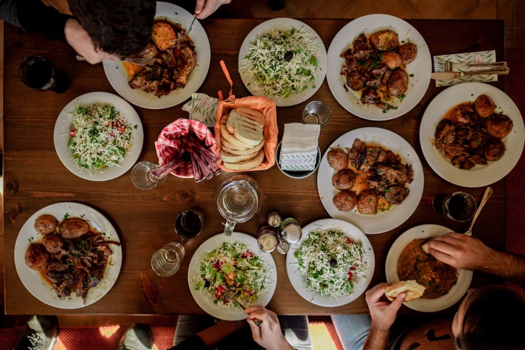White plates with assorted foods for a delicious family dinner.
