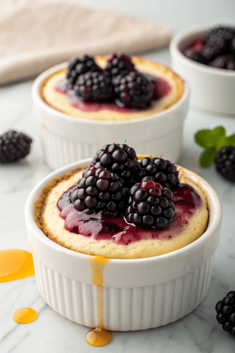 fresh baked mini treats topped with blackberries