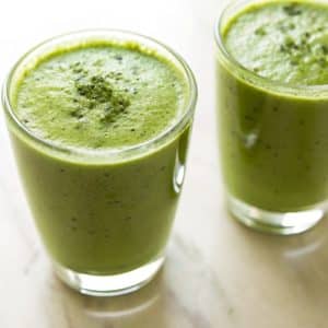 two matcha smoothies in clear glasses