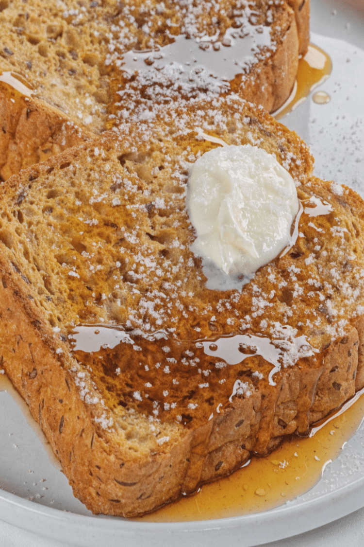 French Toast with Butter, syrup, and powdered sugar