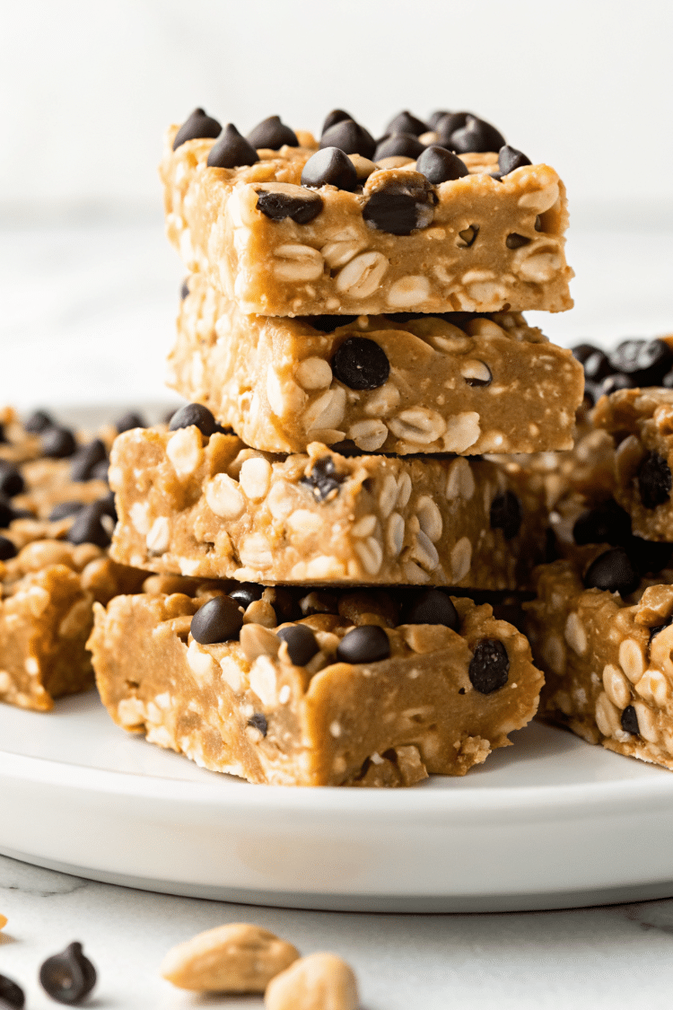 a bunch of stacked cereal bars on a plate