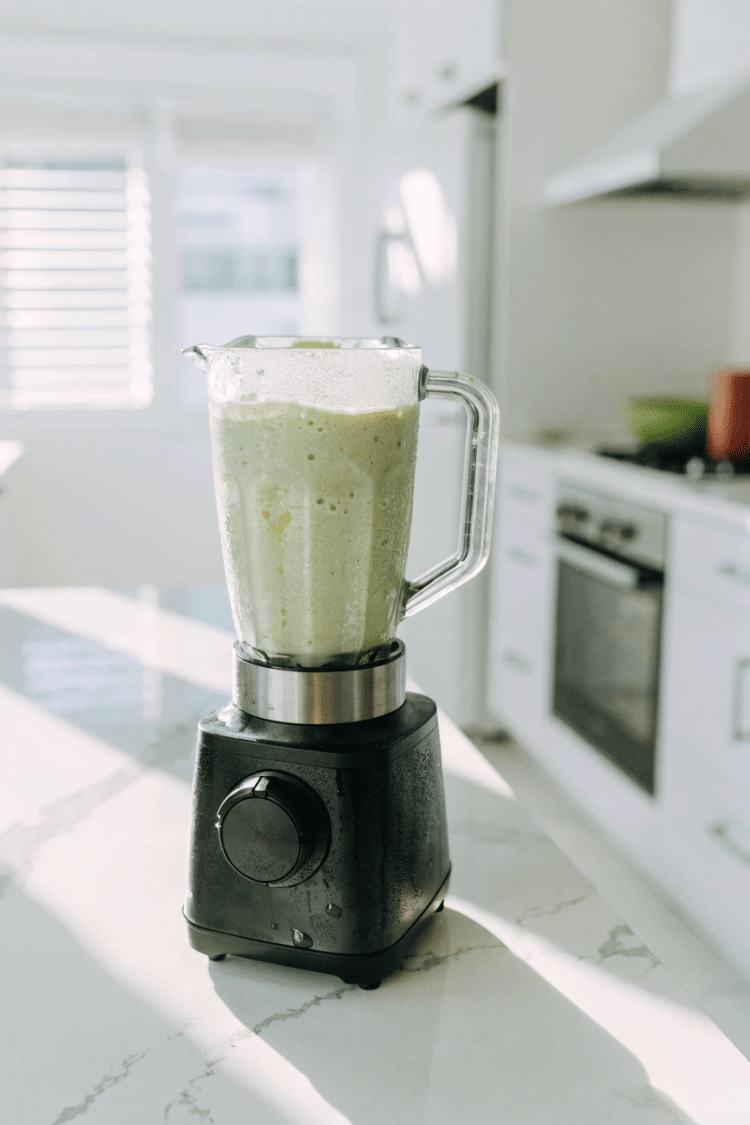 avocado pina colada smoothie in a blender